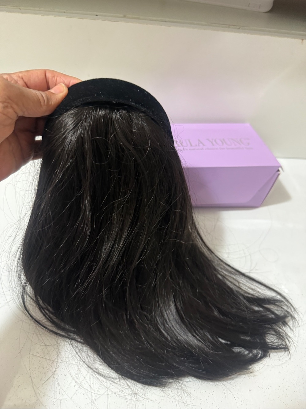 Paula Young Clip-in Hair Topper is easy to use. Attached with a black Hairband